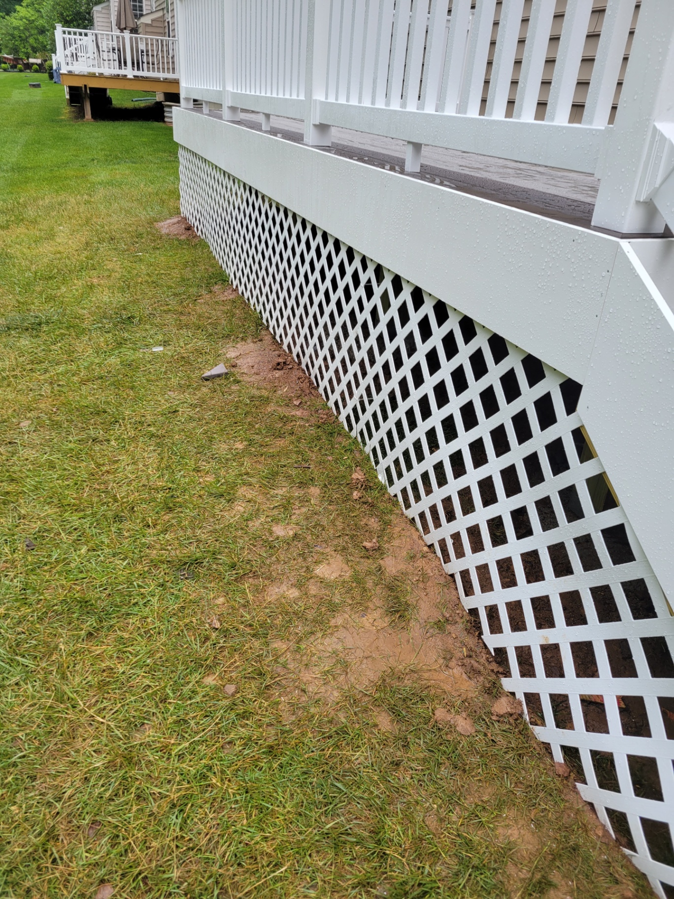White lattice skirting on elevated deck