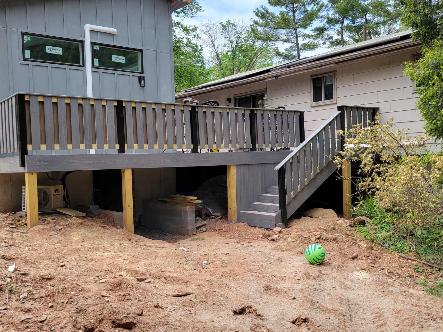 Elevated composite deck with custom railings