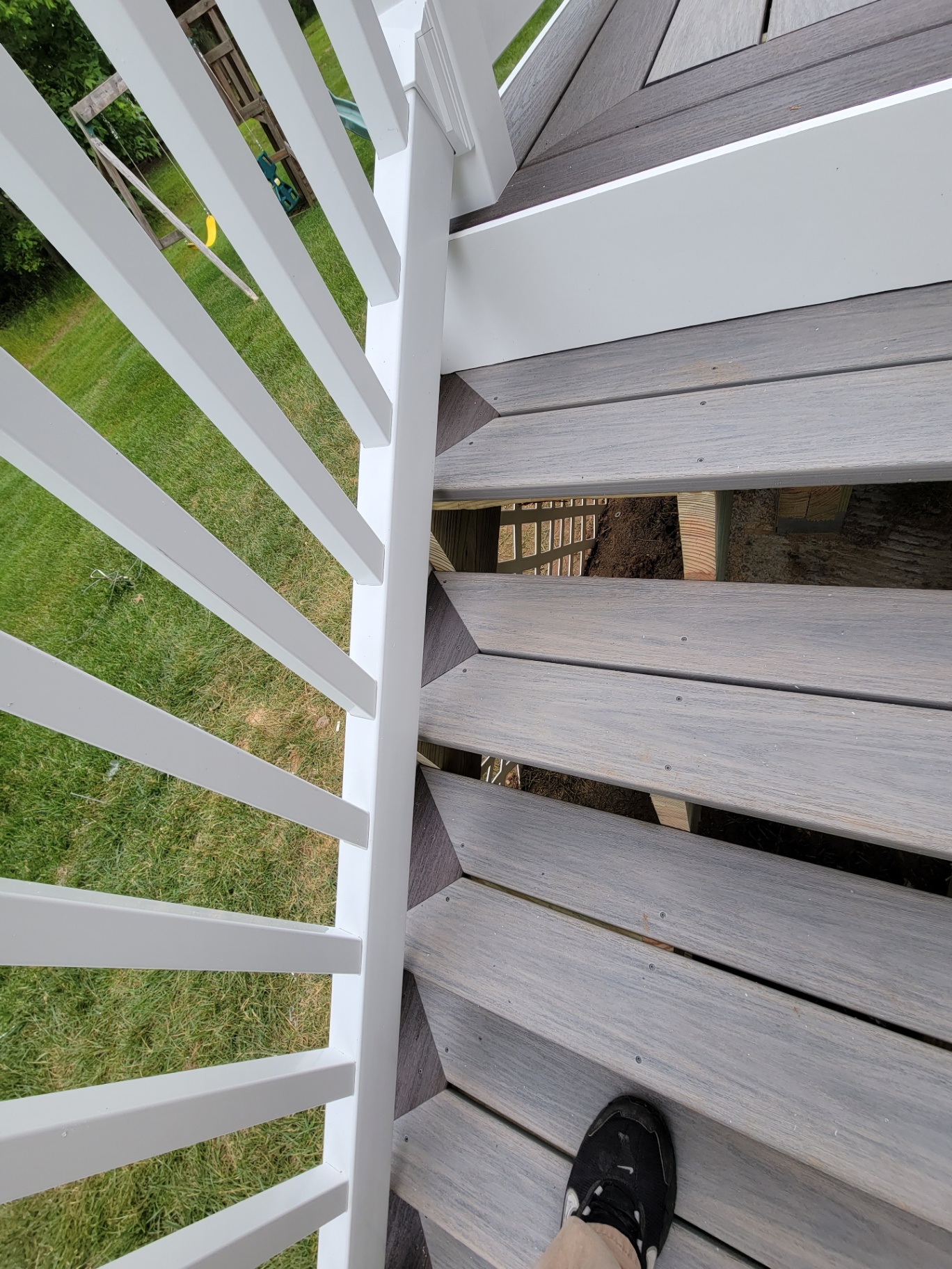 Top-down view of composite deck and white railings
