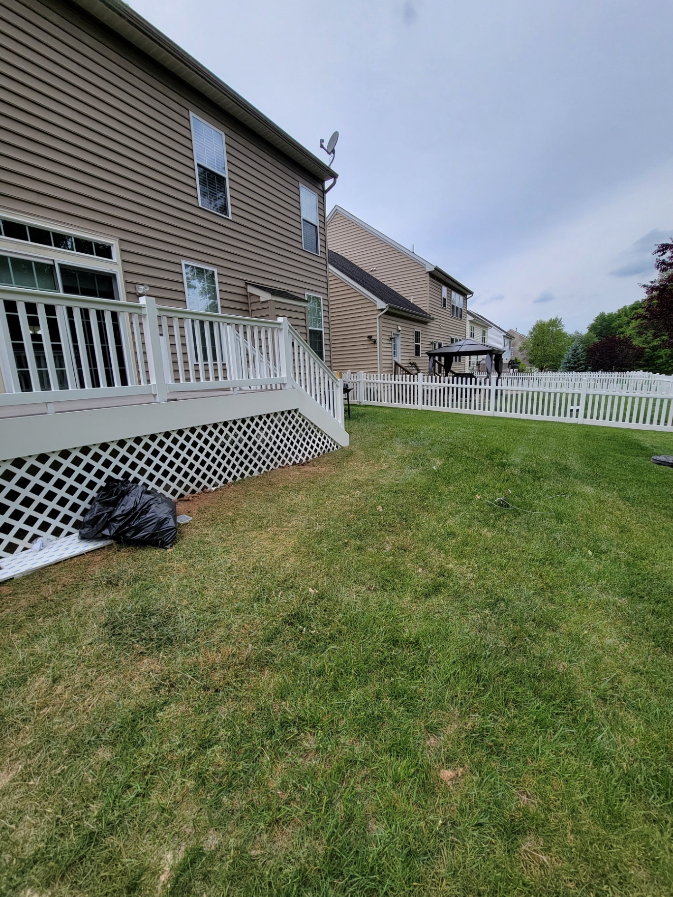 Finished deck with white lattice skirting