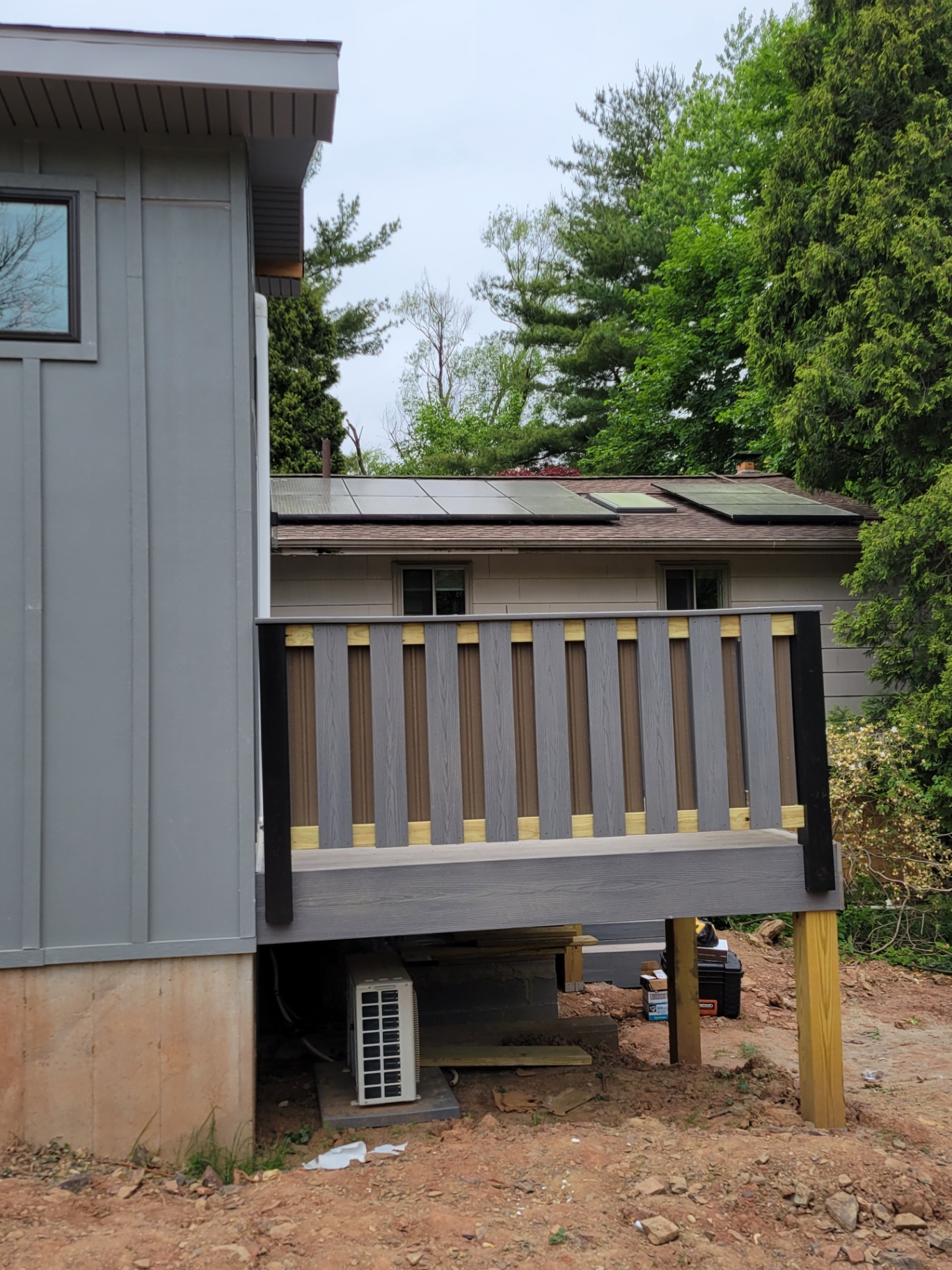Custom composite privacy railing with two-tone gray panels